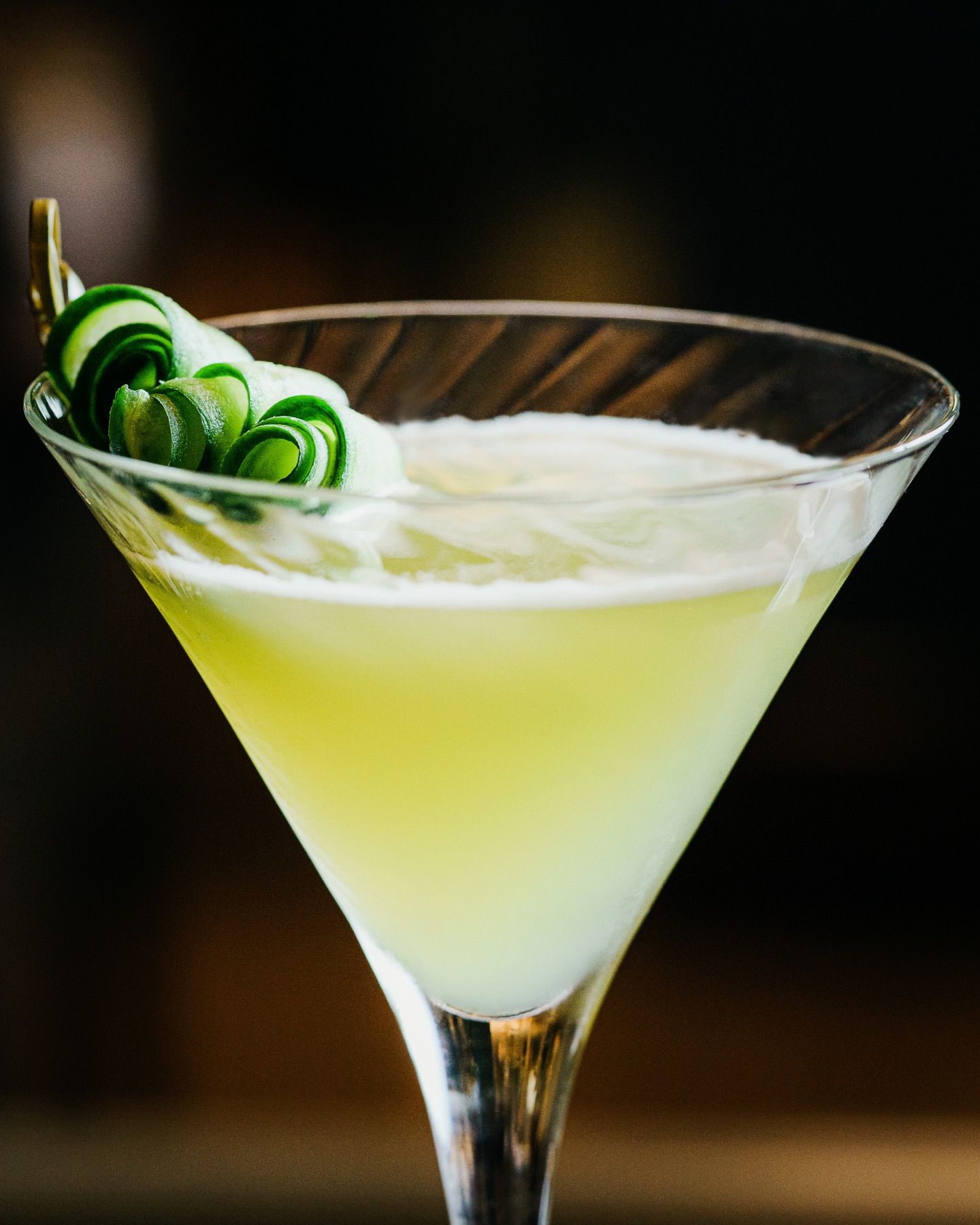 A lime cocktail in a martini glass