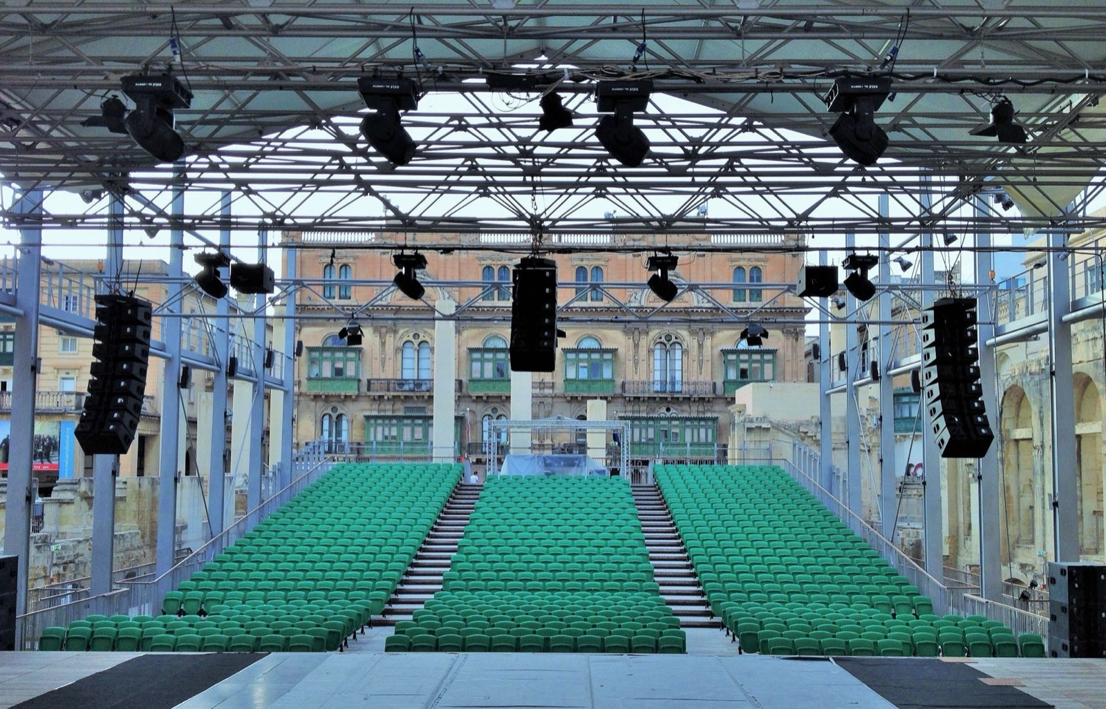An open-air theatre stage prepared for a cultural performance
