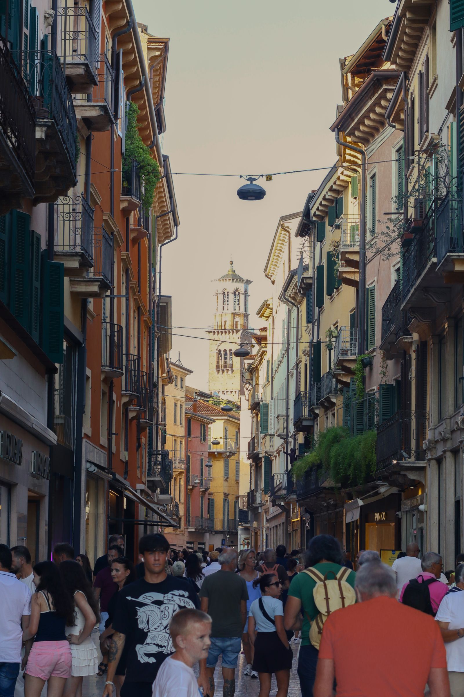 Crowds walking through Verona's historic centre