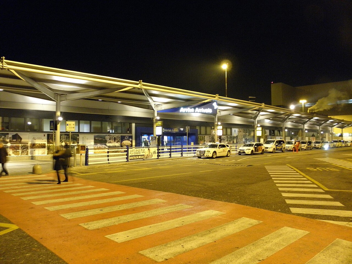 The arrivals terminal and taxi rank at Verona Airport at night