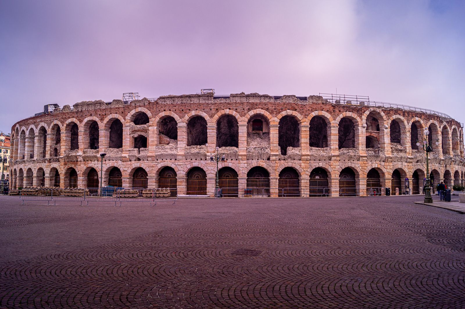 The ancient Arena di Verona in Piazza Bra under a cloudy sky